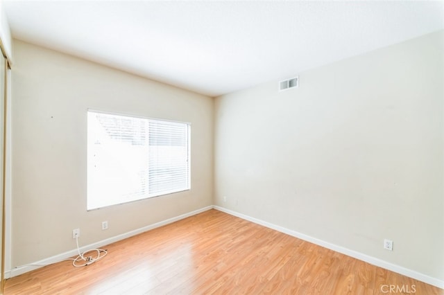 unfurnished room featuring light wood-type flooring