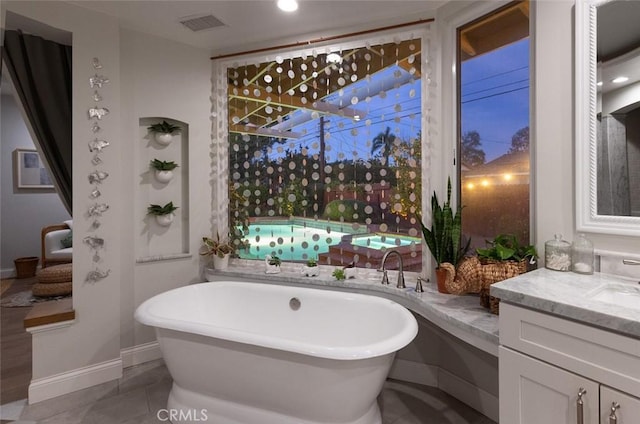 bathroom featuring vanity and a bathing tub