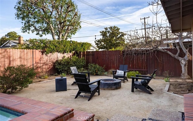 view of patio / terrace with an outdoor fire pit