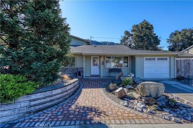 single story home with a garage