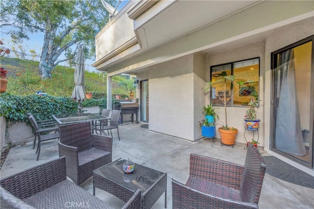 view of patio / terrace featuring an outdoor living space and outdoor dining space