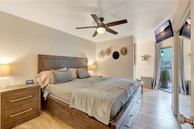 bedroom featuring a ceiling fan and light wood-type flooring