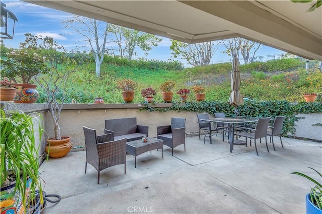 view of patio featuring outdoor lounge area and outdoor dining space