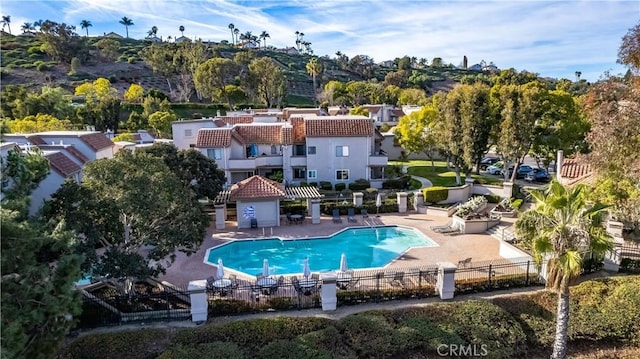 view of swimming pool with a fenced in pool, a patio, and fence