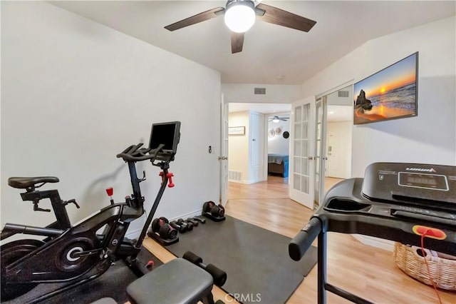 workout room with light wood-type flooring, french doors, baseboards, and visible vents