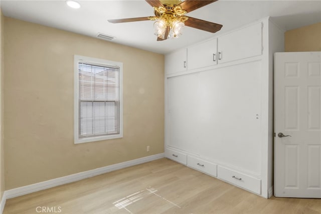 interior space with ceiling fan and light wood-type flooring