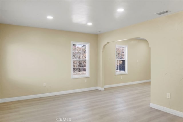 spare room with light hardwood / wood-style floors