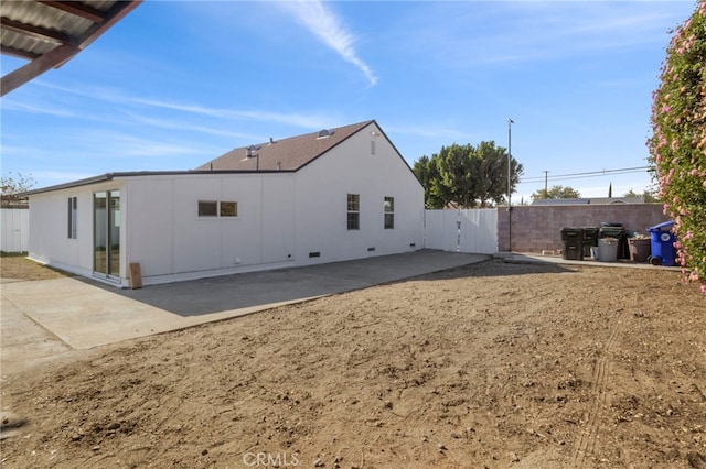 back of property with a patio area