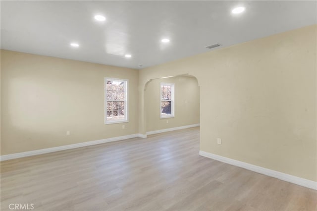 spare room with light hardwood / wood-style floors