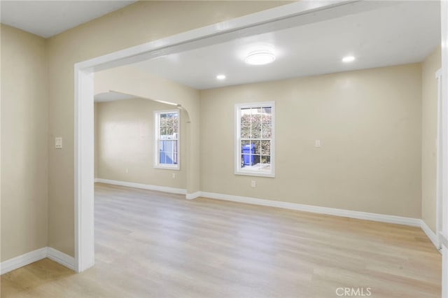 spare room with light hardwood / wood-style floors