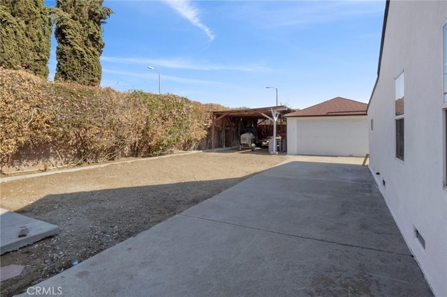 view of front of house with a garage and an outdoor structure