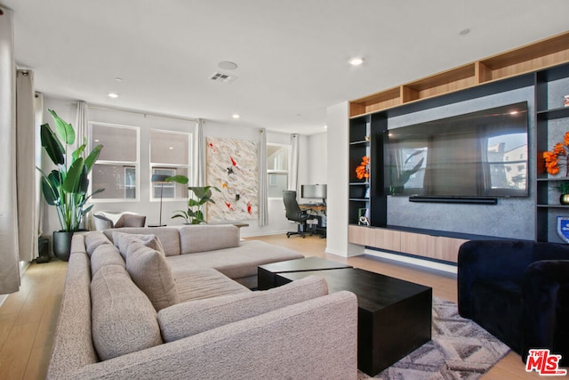 living room with light hardwood / wood-style floors