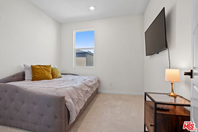 bedroom with light carpet