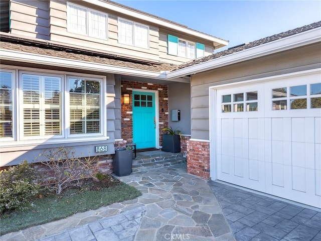 entrance to property featuring a garage