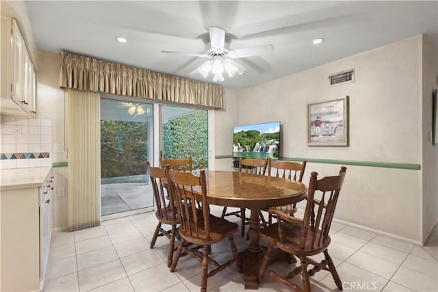 dining room with ceiling fan and light tile patterned floors