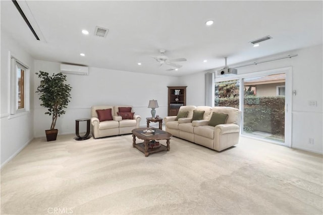 living room featuring ceiling fan, light carpet, and a wall unit AC