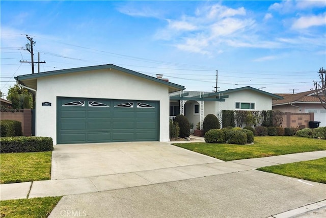 ranch-style home featuring a garage and a front yard