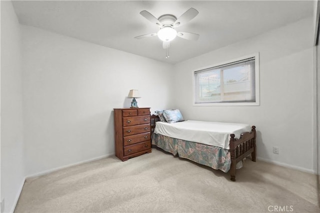 bedroom with light carpet and ceiling fan