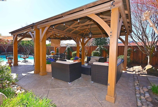 view of patio / terrace with a gazebo, outdoor lounge area, and a fenced in pool