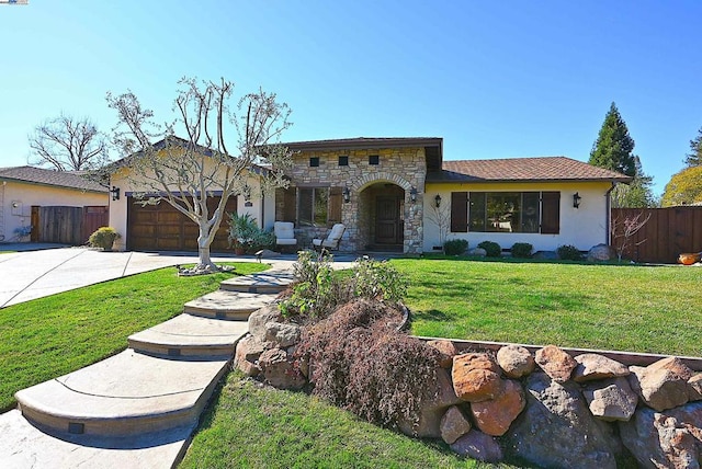 view of front of house with a garage and a front lawn