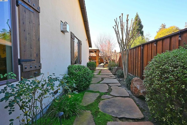 view of side of property with a patio area