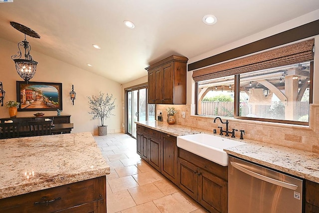 kitchen with sink, vaulted ceiling, hanging light fixtures, dishwasher, and backsplash