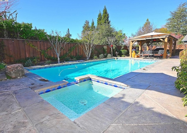 view of swimming pool featuring a gazebo, a patio area, and an in ground hot tub