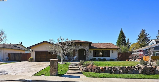 view of front of house featuring a garage and a front lawn