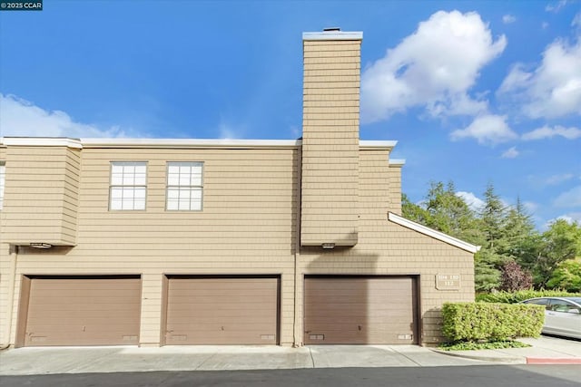 view of property exterior featuring a garage