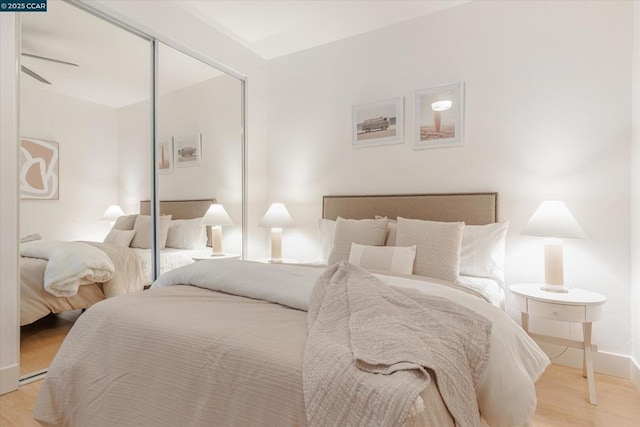 bedroom with a closet and light wood-type flooring