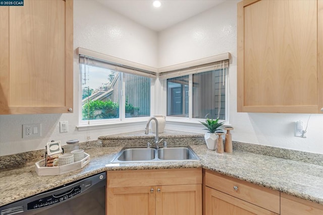 kitchen featuring dishwasher, sink, and light brown cabinetry