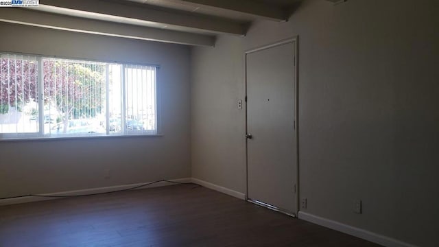 unfurnished bedroom featuring dark hardwood / wood-style floors and beam ceiling