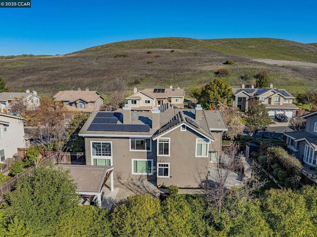 birds eye view of property with a mountain view