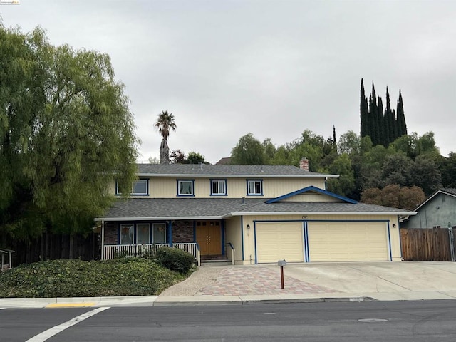 view of front property with a garage and covered porch