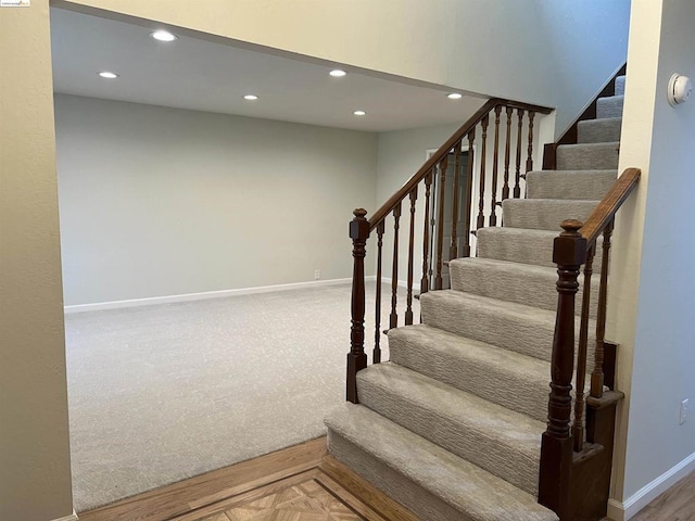 stairway with parquet flooring