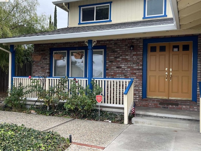 doorway to property with a porch