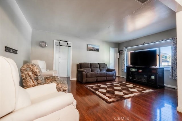 living room with dark hardwood / wood-style floors