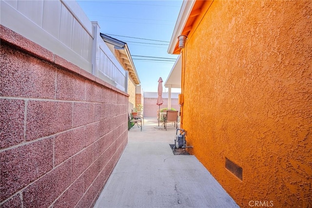 view of side of property featuring a patio