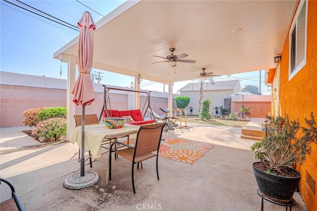 view of patio featuring ceiling fan