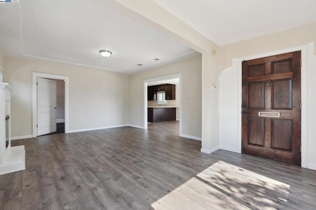 entryway with dark wood-type flooring