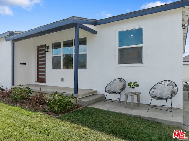 exterior space with a lawn and a patio area