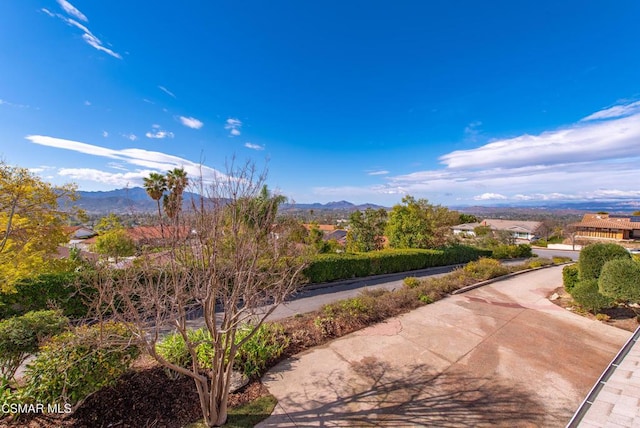 surrounding community featuring a mountain view