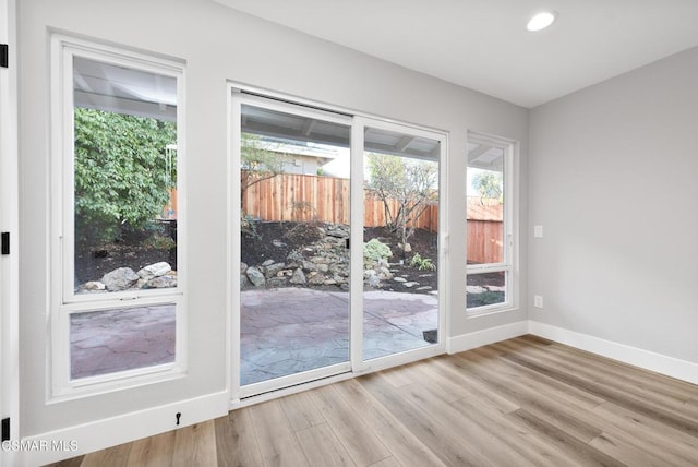 doorway to outside with light hardwood / wood-style floors