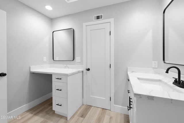 bathroom featuring vanity and wood-type flooring