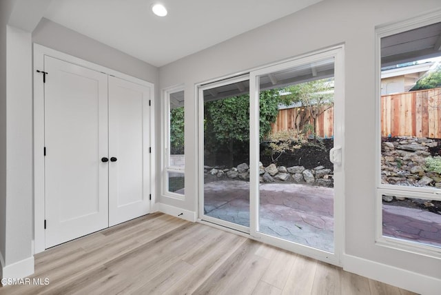 entryway with light wood-type flooring