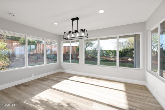 unfurnished sunroom with a wealth of natural light