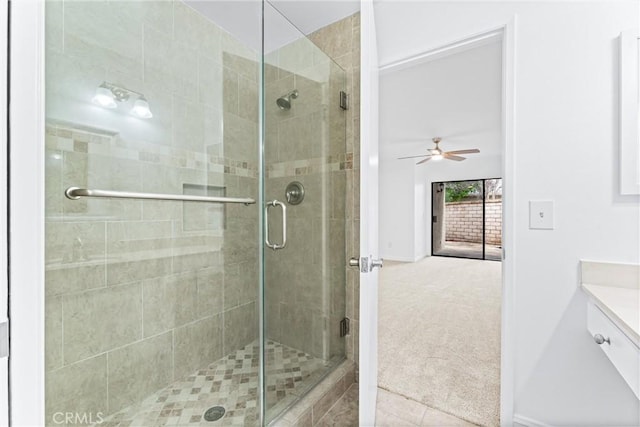 bathroom featuring a shower stall, vanity, and tile patterned floors