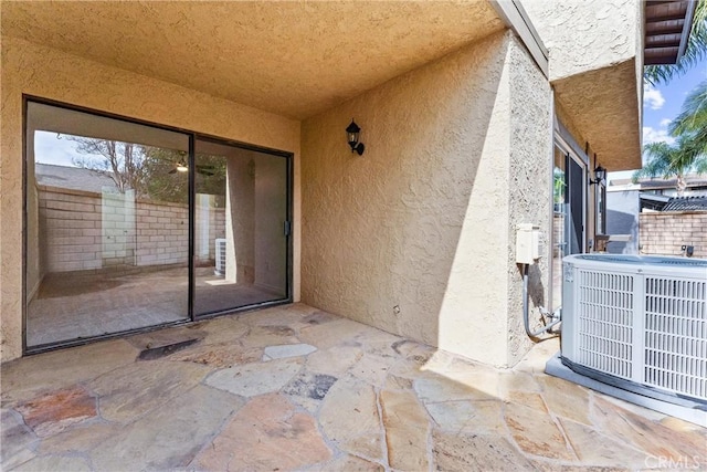 view of patio with central AC unit