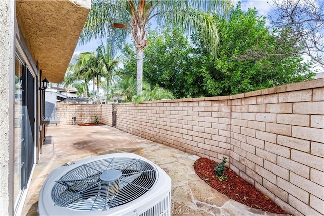 view of patio featuring central AC and a fenced backyard