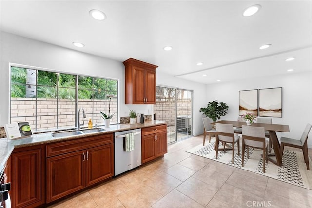 kitchen with recessed lighting, a sink, stainless steel dishwasher, and light stone countertops